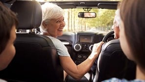 00141 - Grandparents and children together in a car on a long journey - 16_9