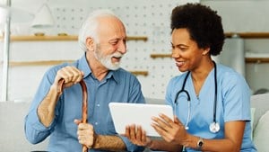 Man with nurse seeing tech options