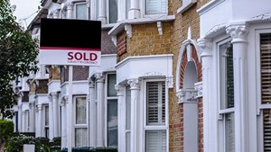 Terraced houses with a for sold sign