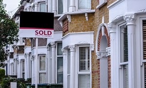 Terraced houses with a for sold sign