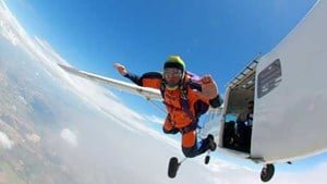 skydiver jumping out of airplane