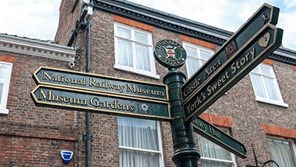 Pedestrian street sign in York pointing to National Railway Museum