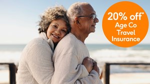 Couple hugging on the beach with 20% off roundel