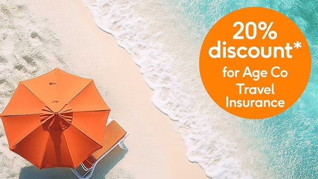 Aerial view of umbrella on beach next to a 20% discount roundel promo