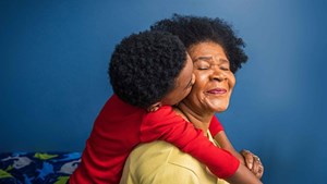 older-lady-cuddling-grandchild-campaign