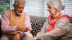 couple-looking-at-personal-alarm-16-9-compressed