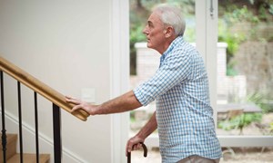 senior-man-climbing-upstairs-with-walking-stick-16-9-compressed.jpg