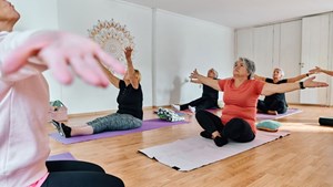 a-group-of-senior-women-engage-in-various-yoga-16-9