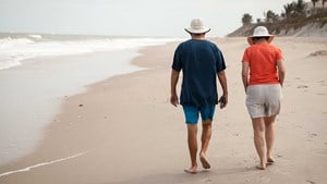 Couple walking along a beach